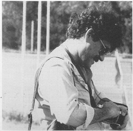 Victor Ostrovsky reloading a camera while in the midst of a Mossad photography exerrcise