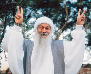 Chandra Mohan showing a "Neronic cross" or "reverse broken cross" Satanic hand sign