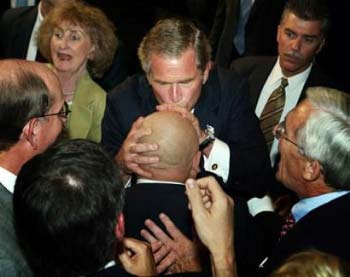 Bush kisses head